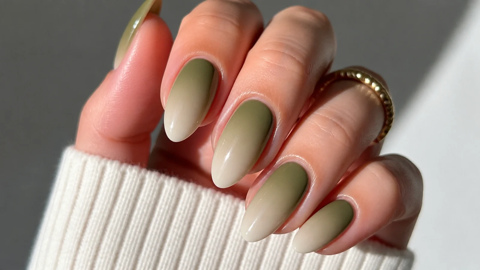 Olive green to cream ombre fade nails on an almond shape