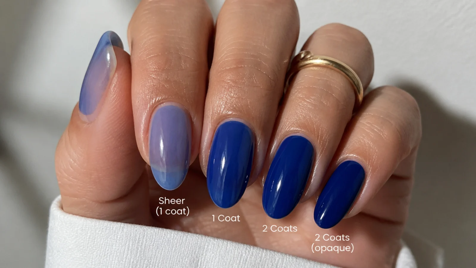 Two royal blue gel coats building a deep true color compared to sheer polish