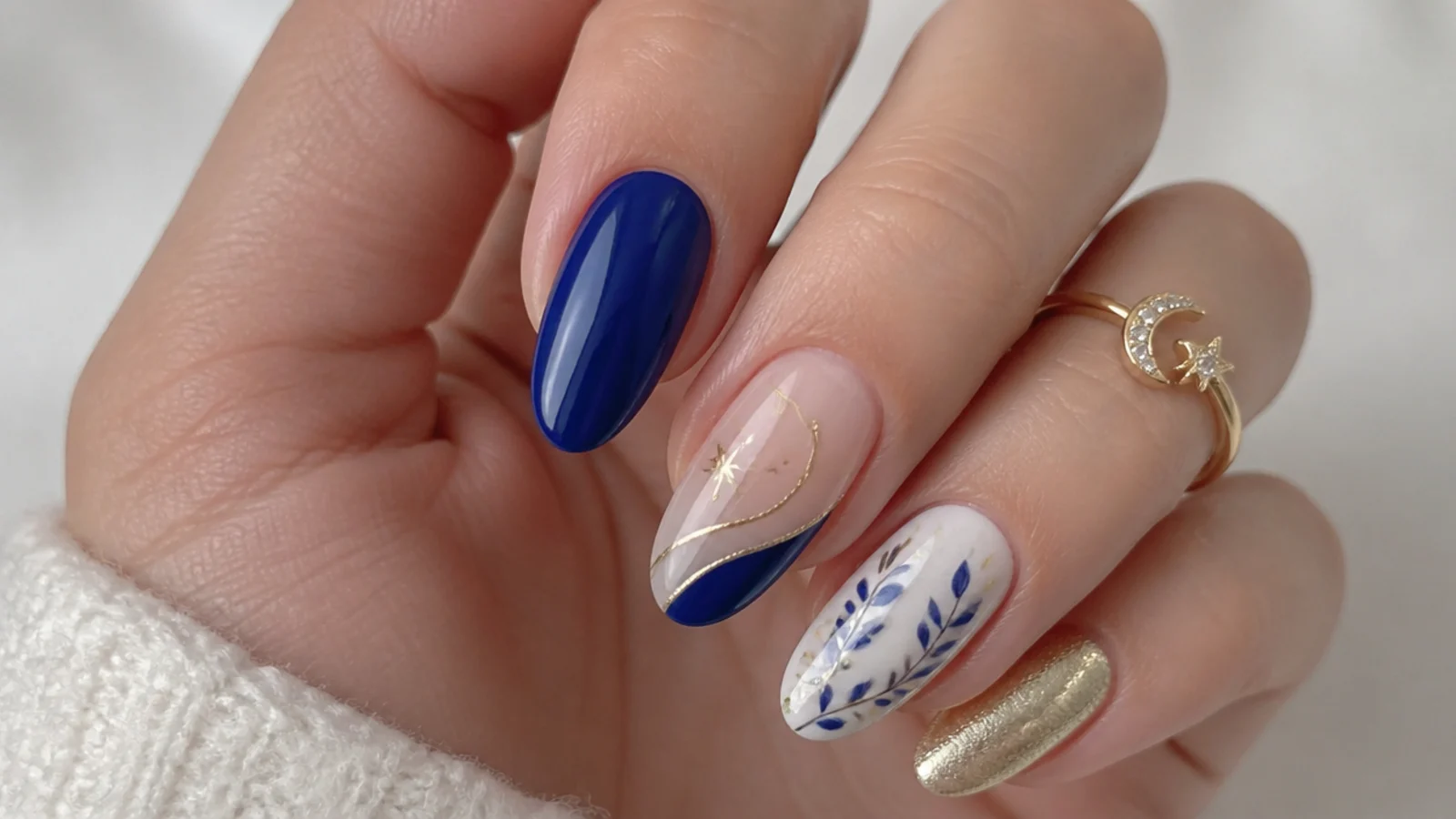 Royal blue nails shown paired with gold, silver, white and nude accents