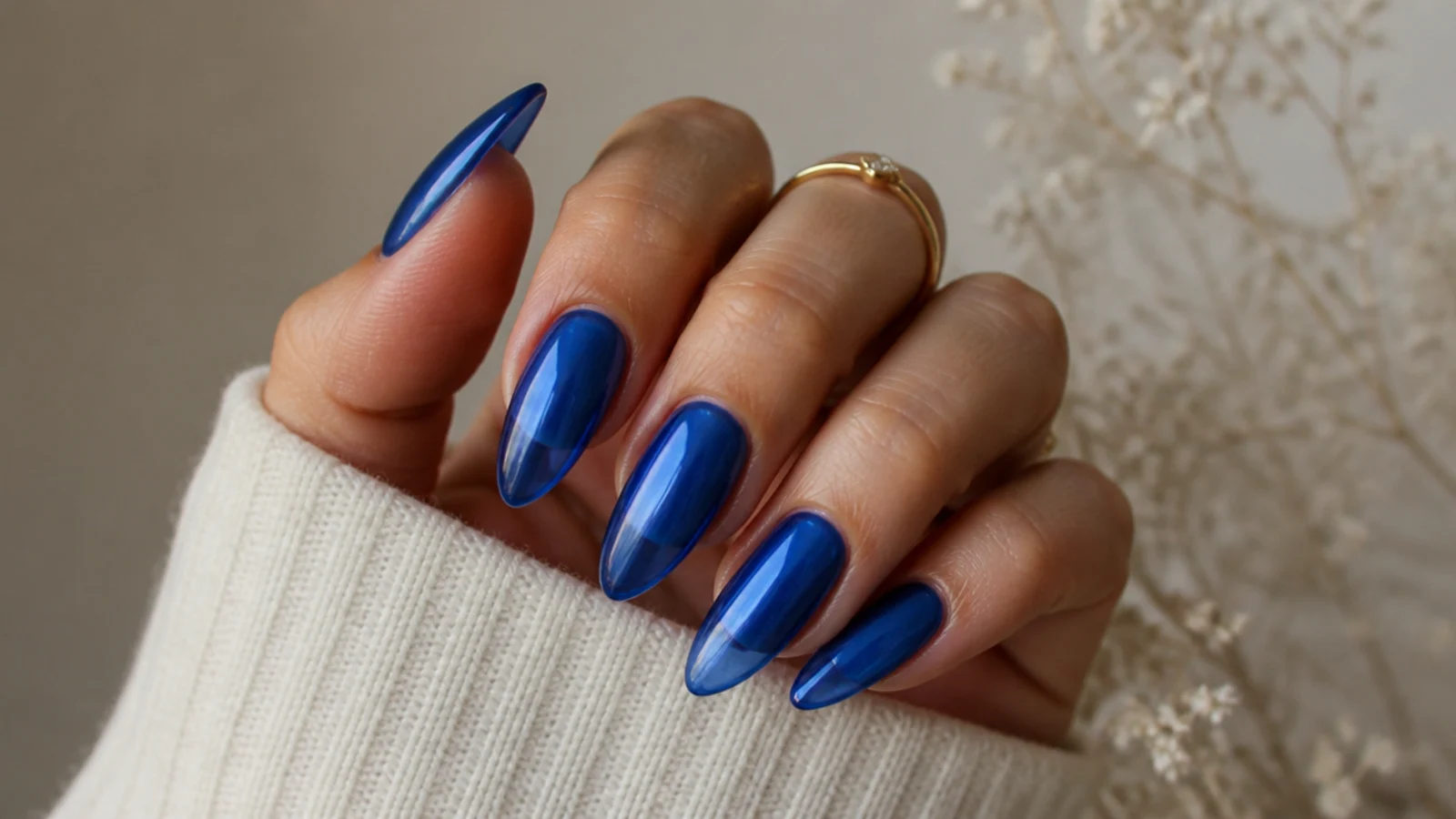 Sheer royal blue jelly acrylic nails with a translucent glassy finish
