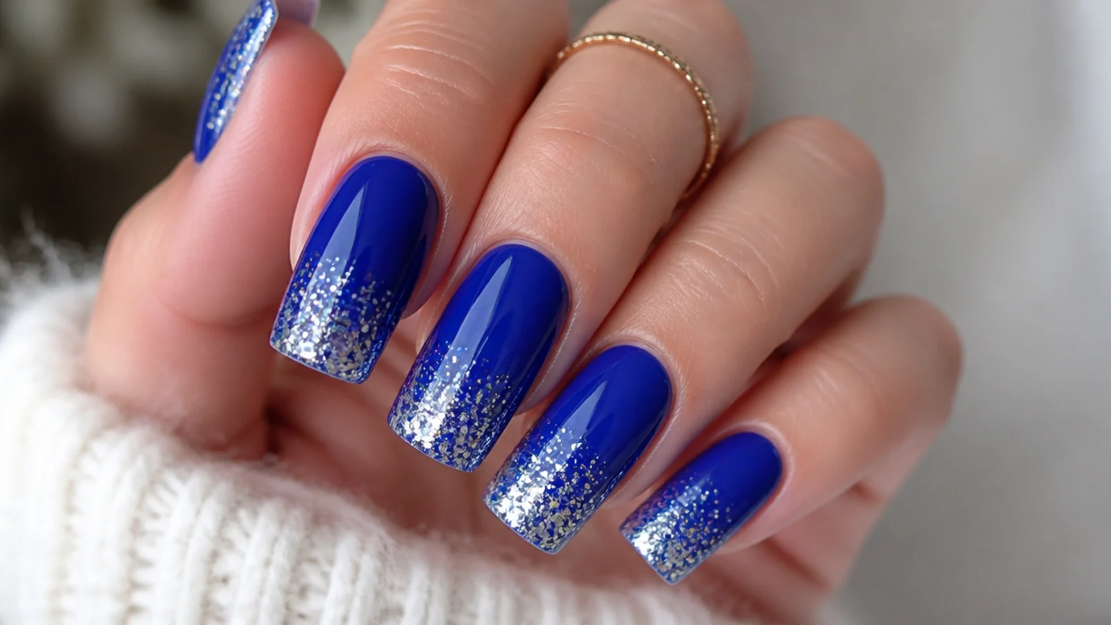 Royal blue acrylic nails with silver glitter gradient tips on square nails