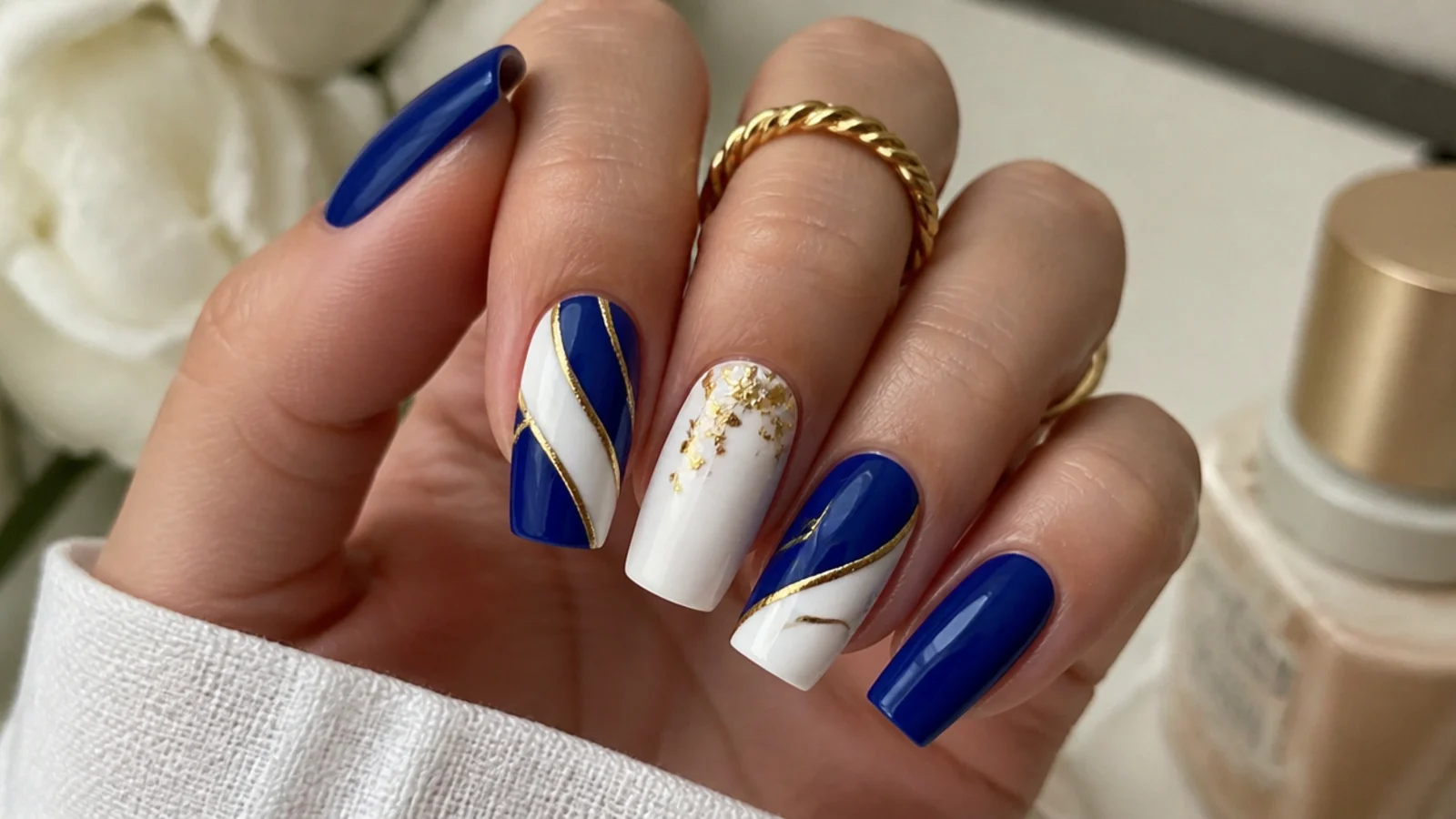 Royal blue acrylic nails color blocked with white and gold on square nails