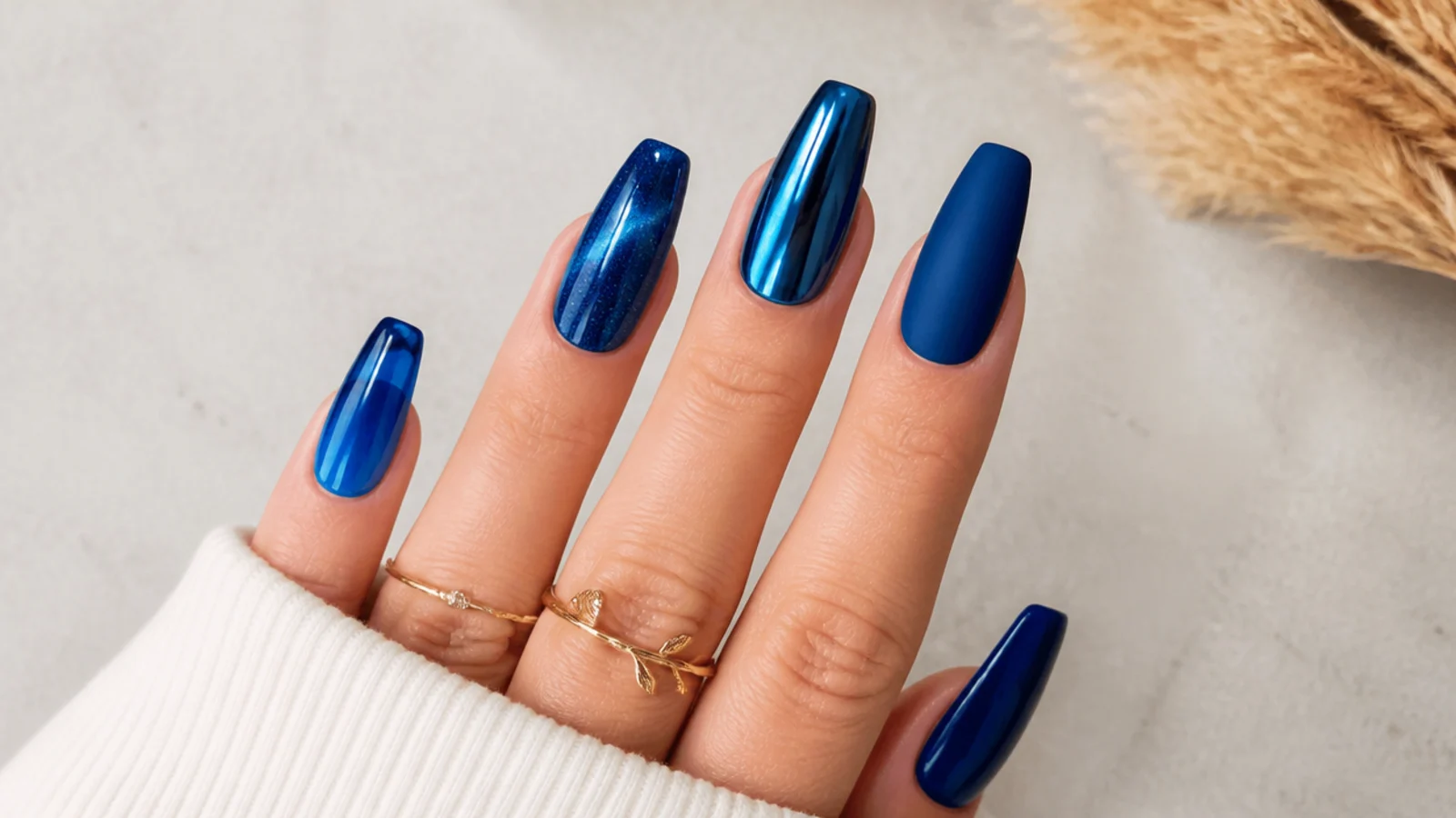 Royal blue nails shown in glossy, chrome, cat-eye, jelly and matte finishes