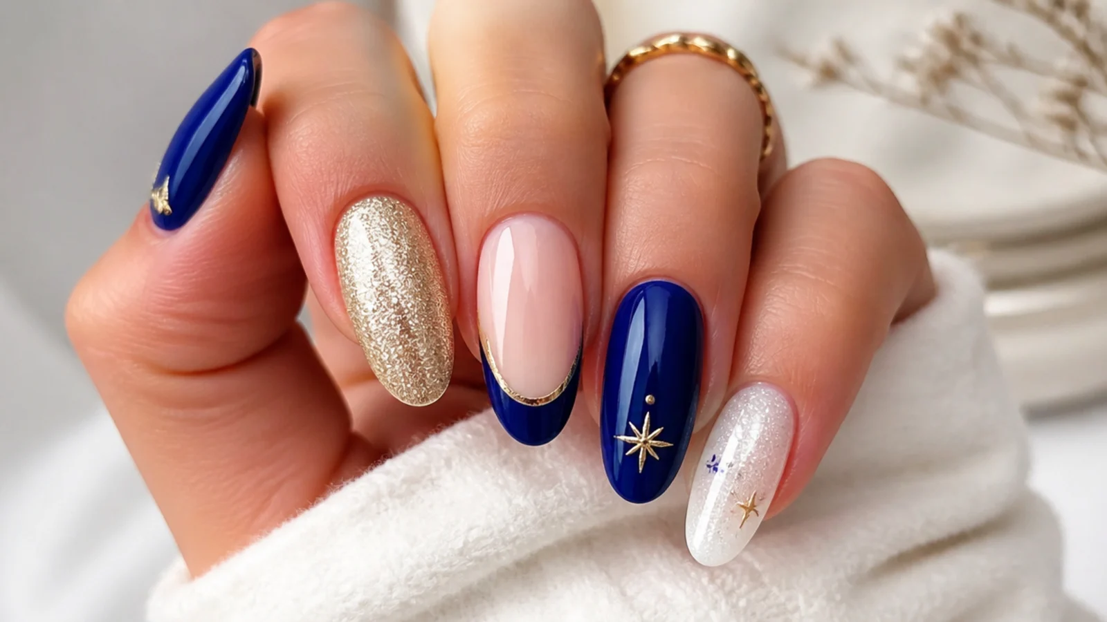 Royal blue nails paired with gold, silver, white and nude accent swatches
