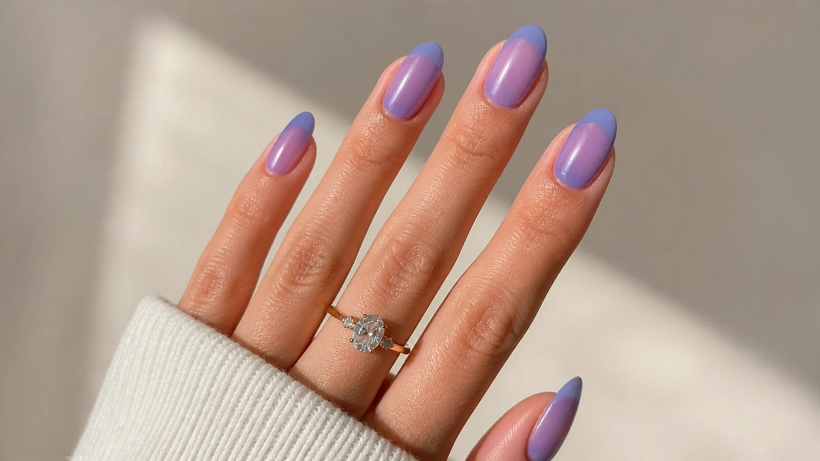 Sheer royal blue wash almond nails with the natural nail glowing through