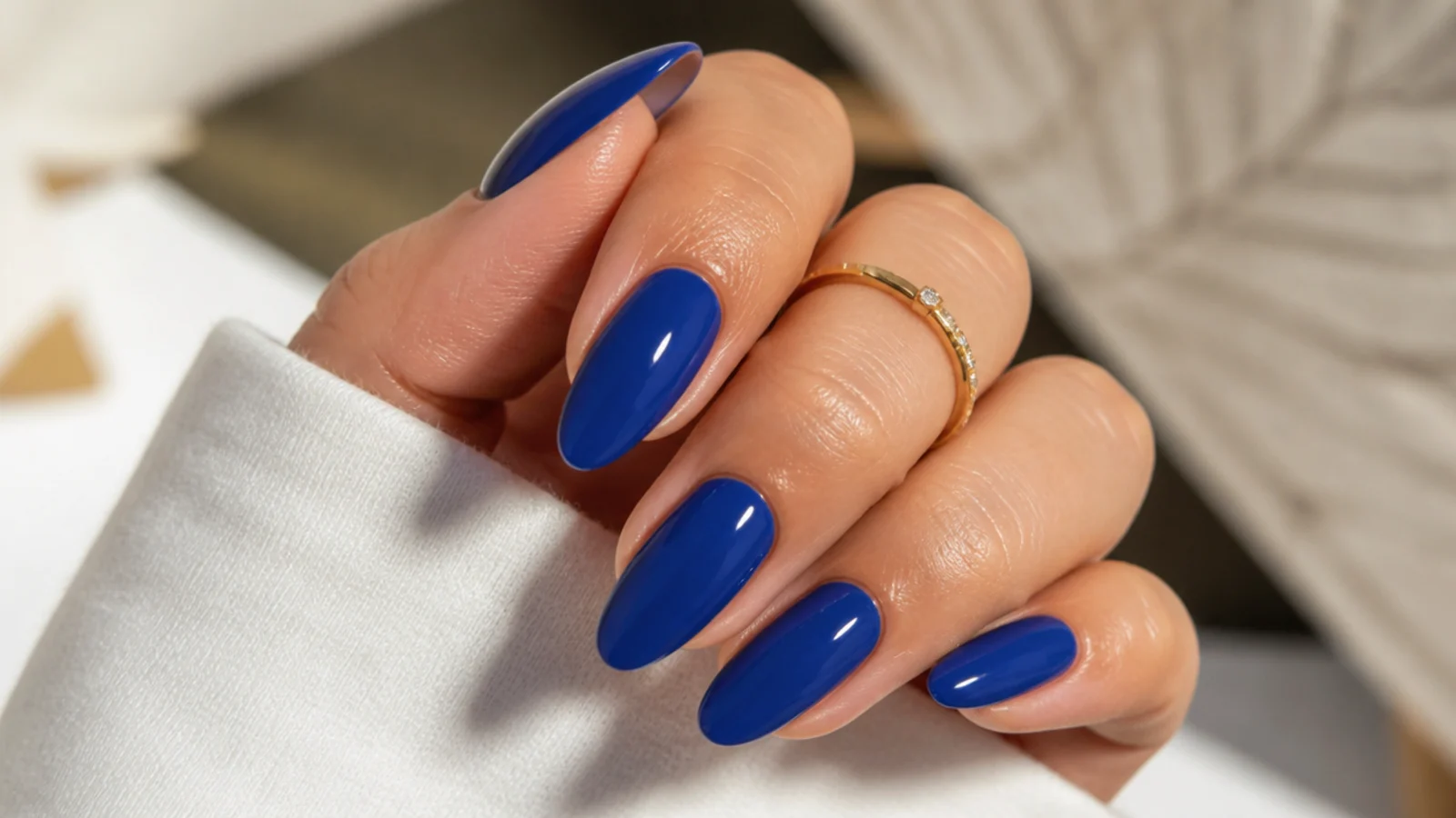 Two coats of royal blue gel building deep true color on almond nails