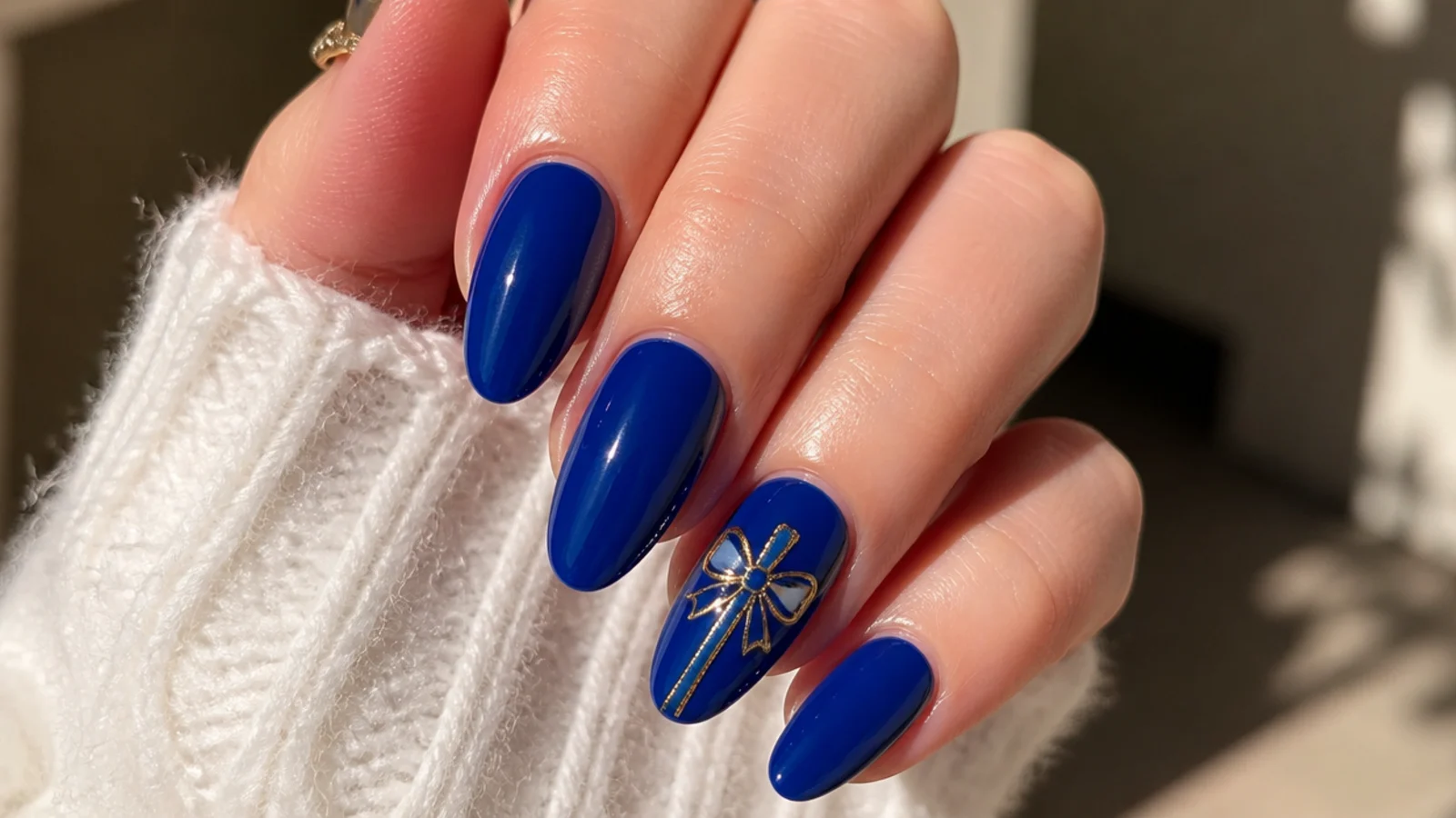 A well-sealed royal blue almond manicure with cuticle oil for longevity
