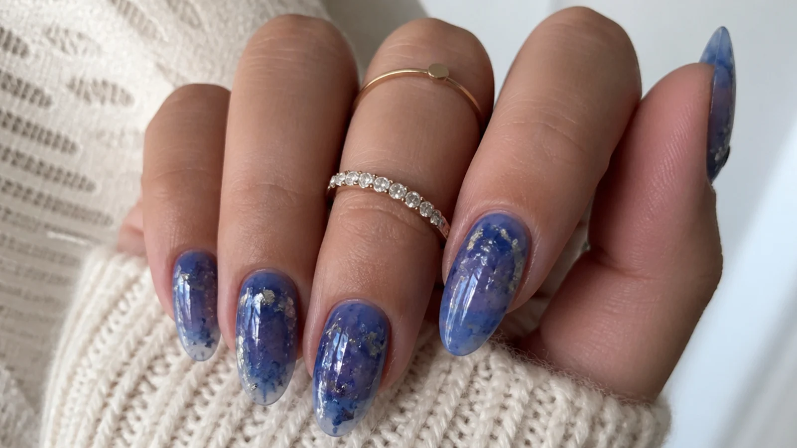 Translucent royal blue jelly nails with suspended silver flakes