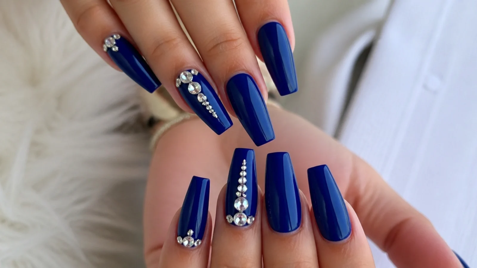 Royal blue coffin prom nails with silver rhinestone clusters