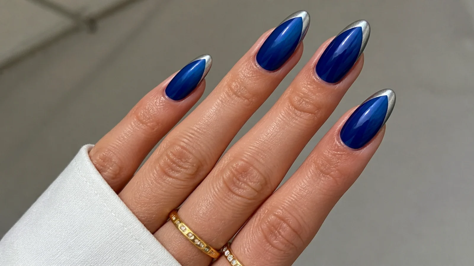 Royal blue nails with a pearly silver glazed chrome French tip