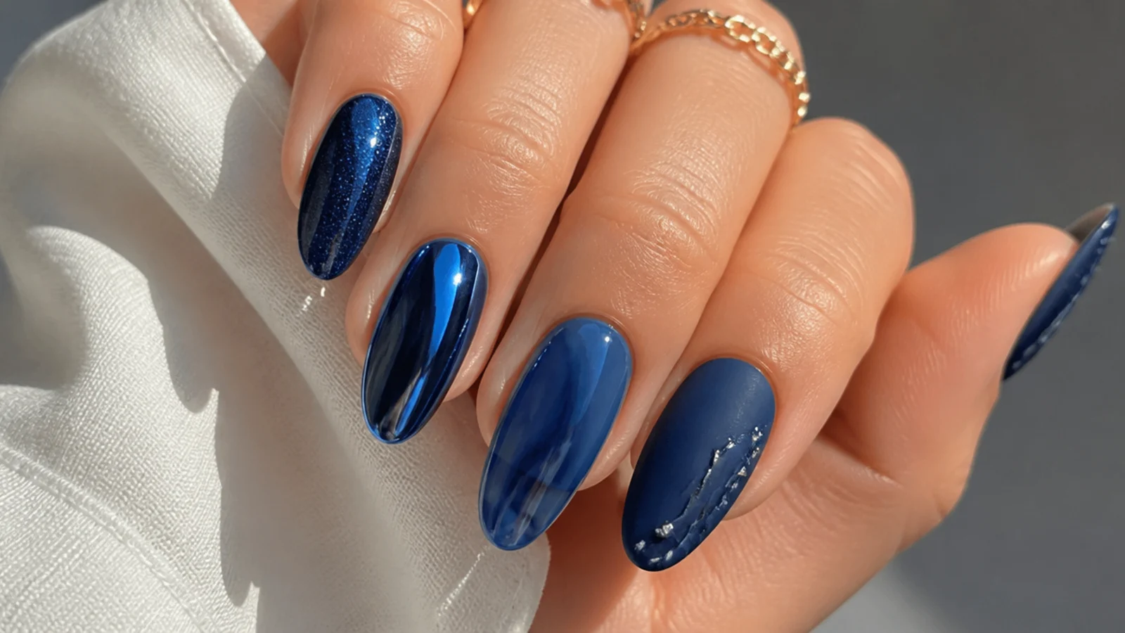 Royal blue nails in glossy, chrome, cat-eye, jelly and matte finishes