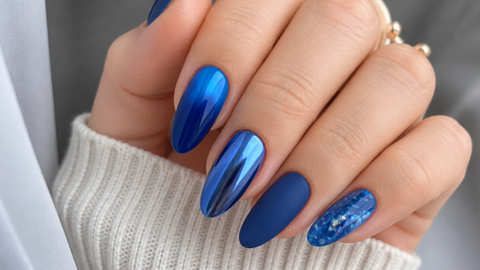 Royal blue nails shown in glossy, chrome, matte and jelly finishes across shapes