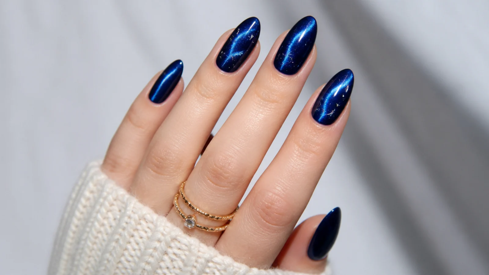 Royal blue cat eye nails styled for prom, a wedding and everyday wear