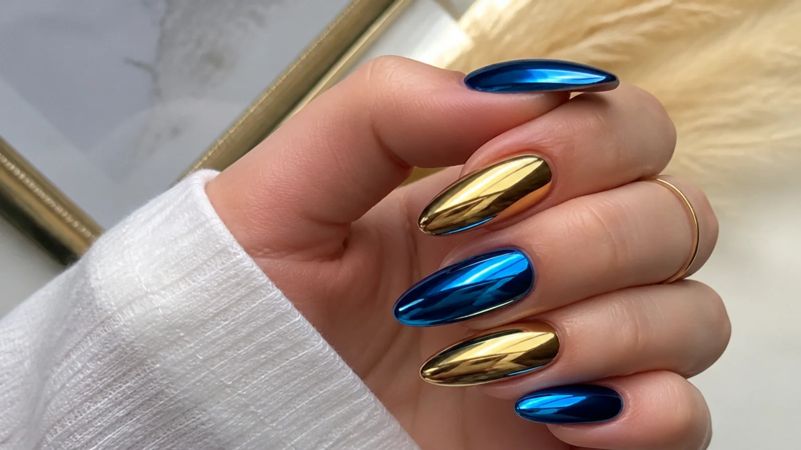 Royal blue chrome nails with warm gold chrome accent nails