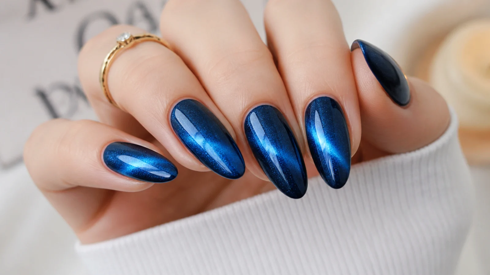 Royal blue cat-eye nails with a bright magnetic chrome light strip