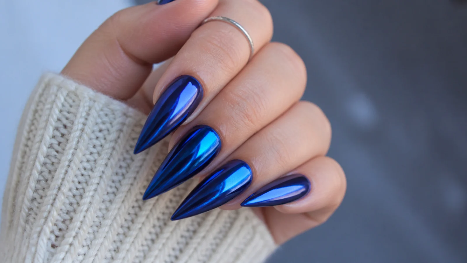 Long stiletto nails in deep midnight royal blue chrome