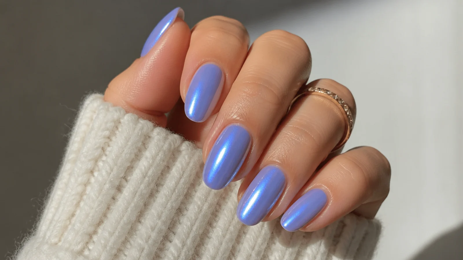Sheer royal blue nails with a glazed pearl chrome donut shine