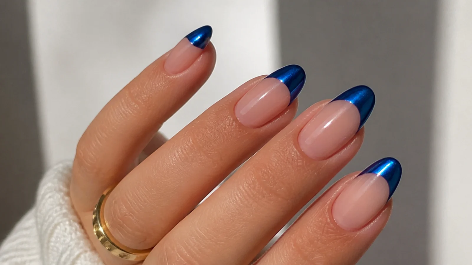 Royal blue french tips finished with blue chrome powder for a mirror shine