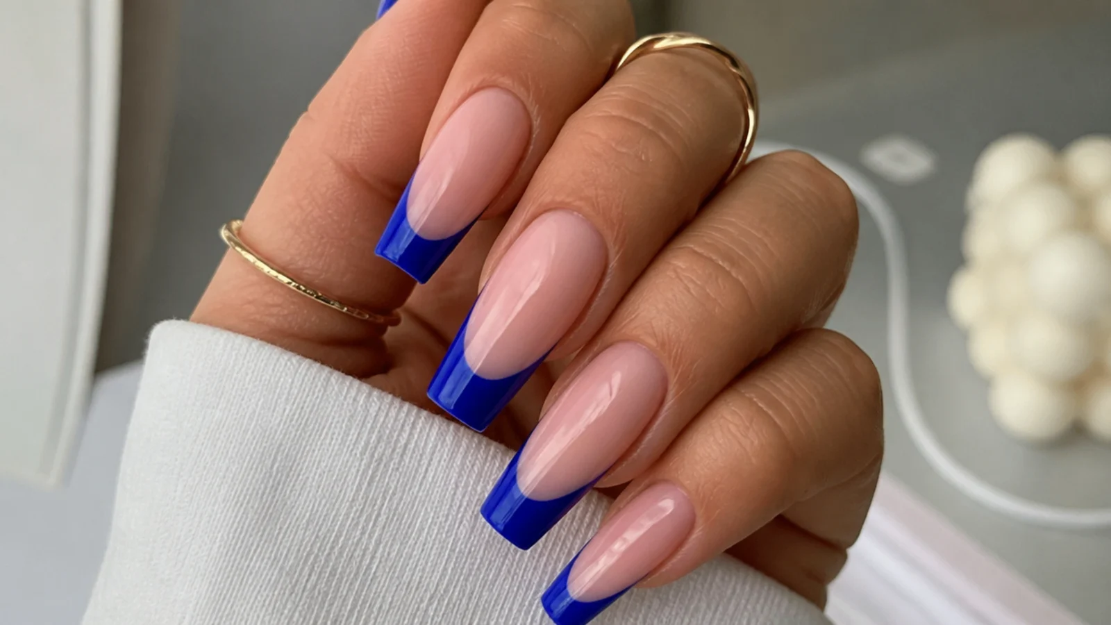 Royal blue french tips on long coffin nails over a nude base