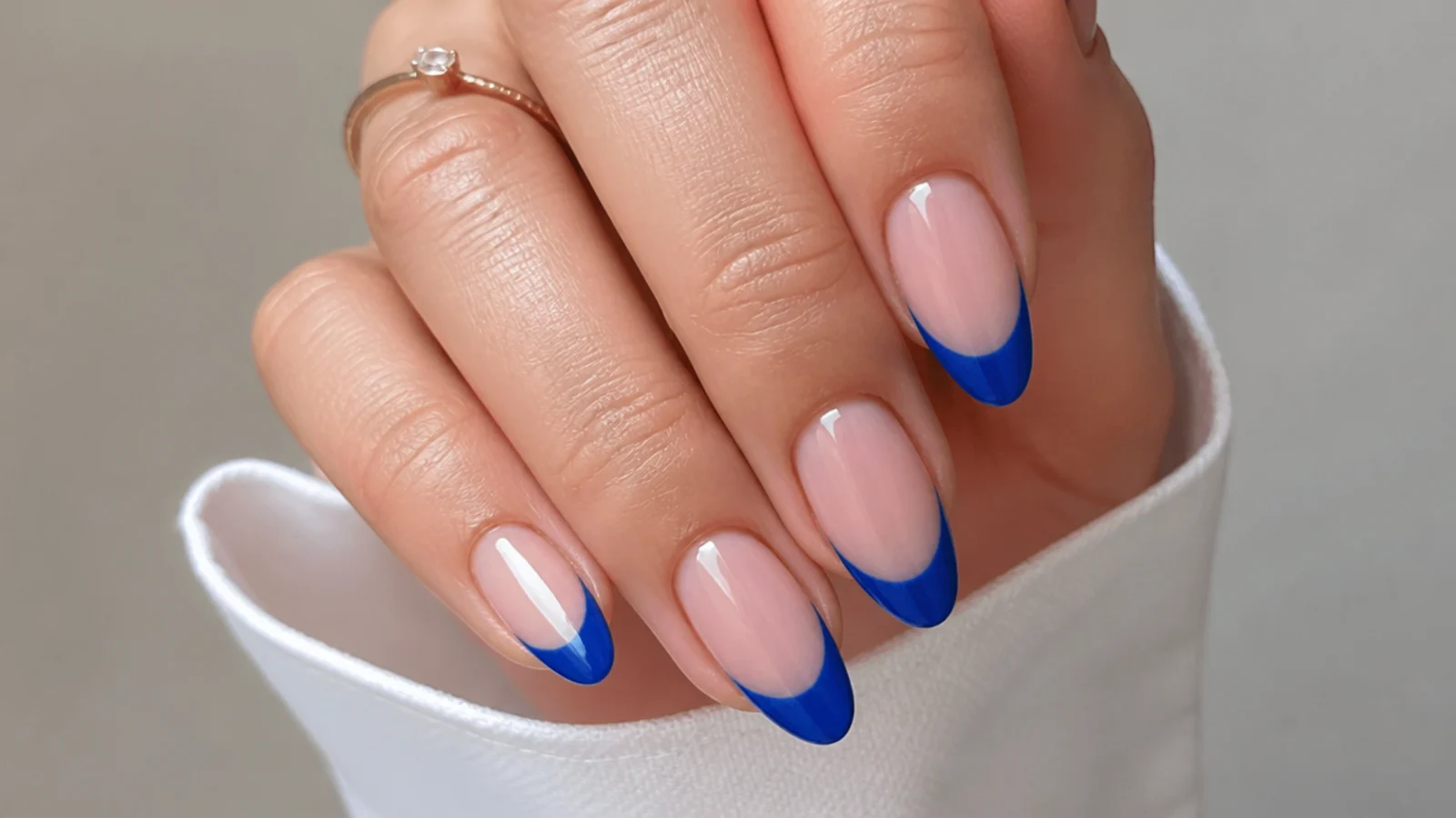 Sheer royal blue jelly french tips with a translucent glass finish