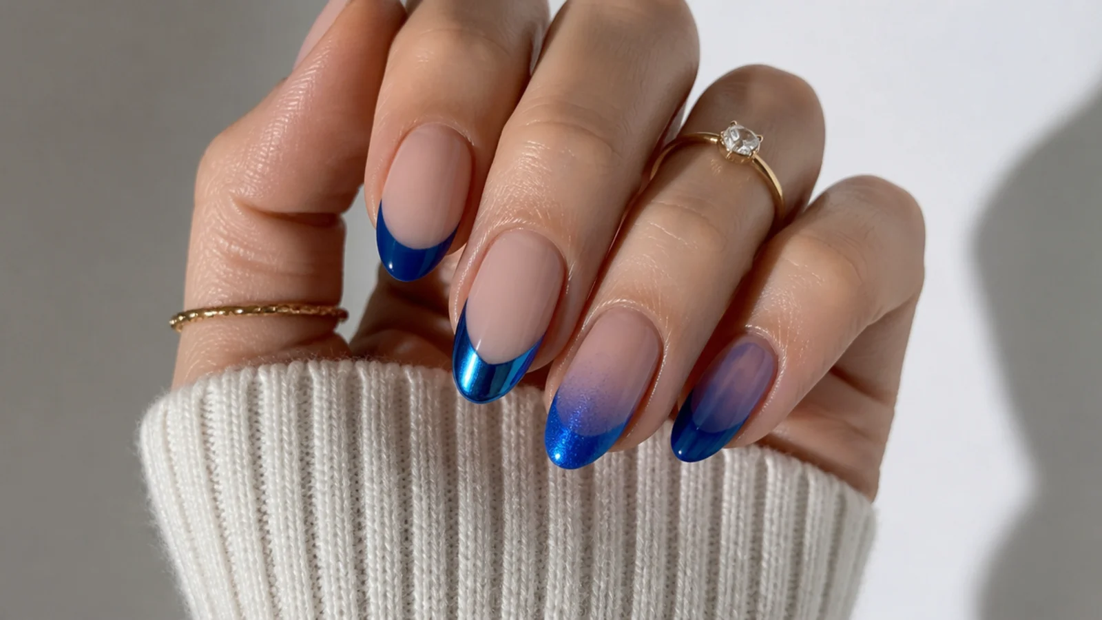 Royal blue french tips shown in glossy, chrome, cat-eye and jelly finishes