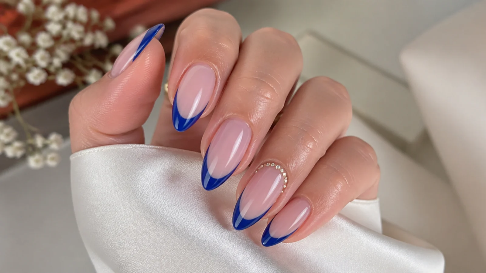 Royal blue french tips styled for prom, weddings and everyday wear