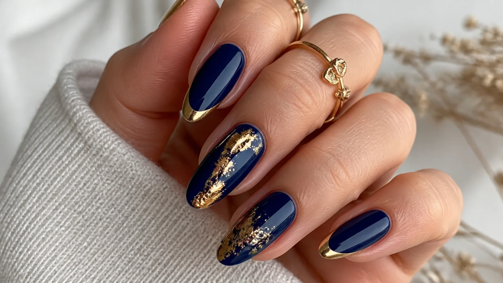 Royal blue nails with gold foil and gold french accents