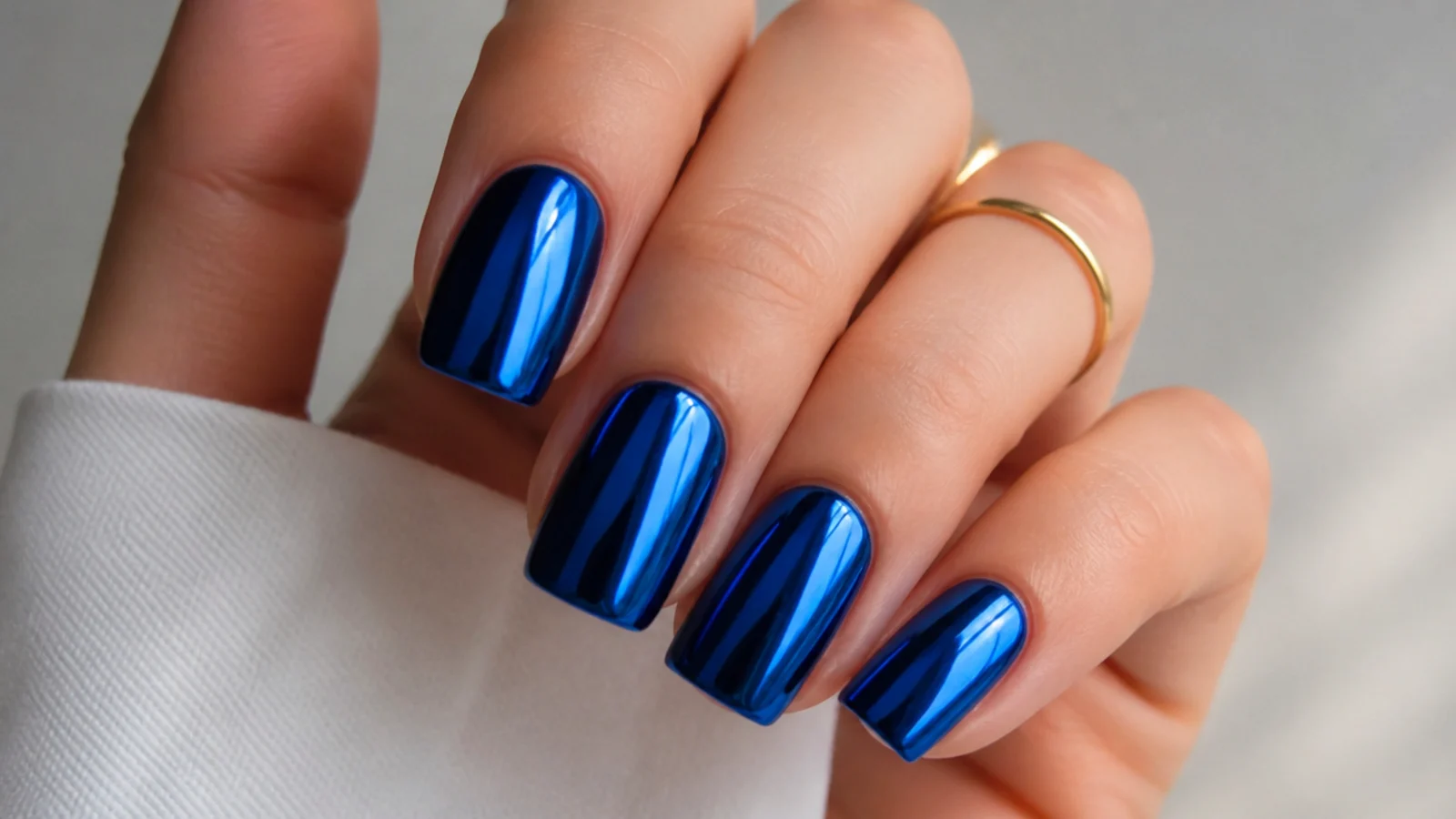 Full royal blue chrome mirror nails with a metallic finish