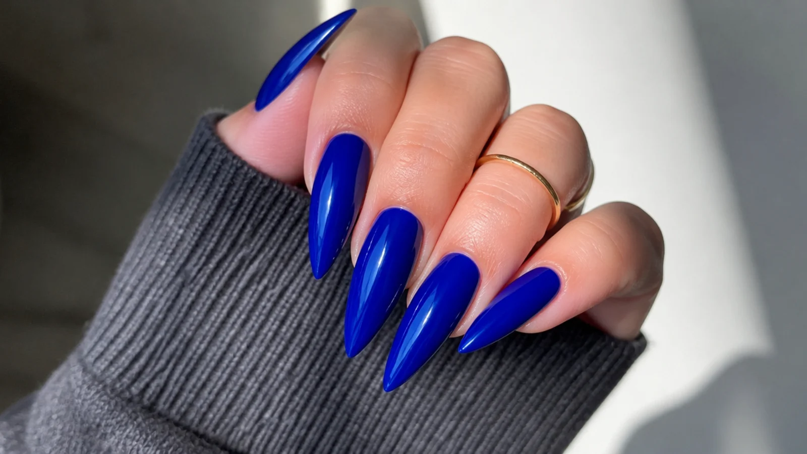 Long pointed royal blue stiletto nails with high shine