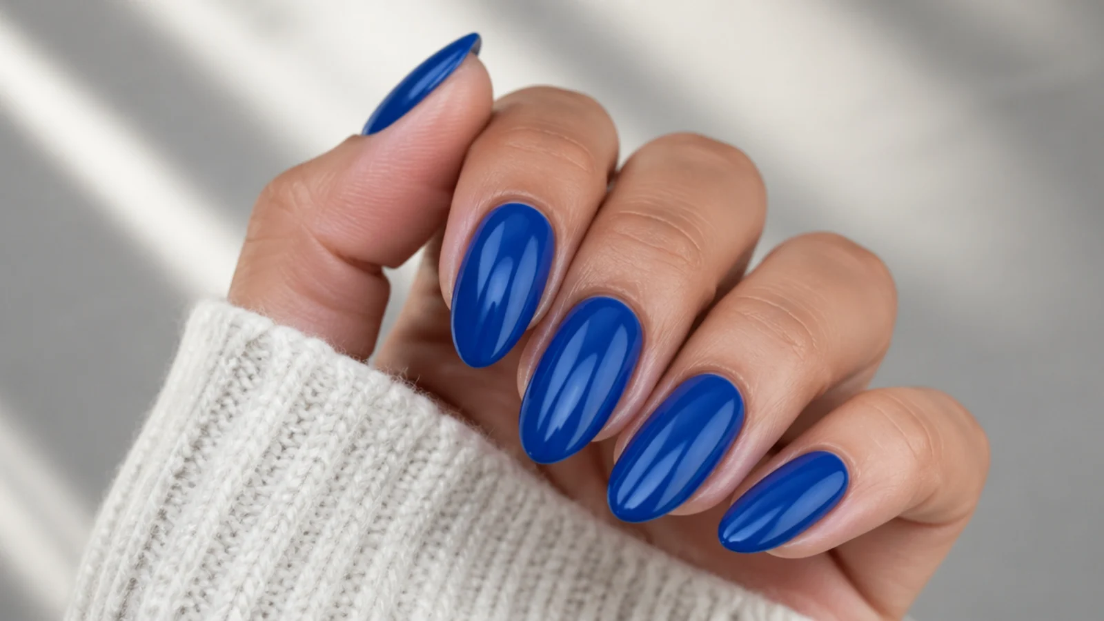 A well-sealed royal blue gel manicure with cuticle oil for longevity