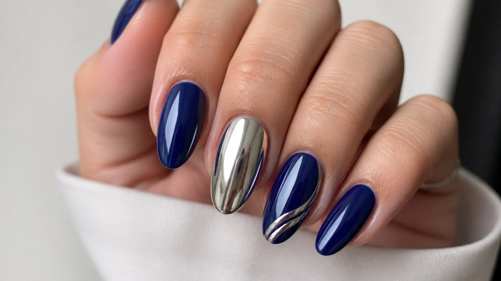 Royal blue nails with silver chrome accent nails and glossy blue