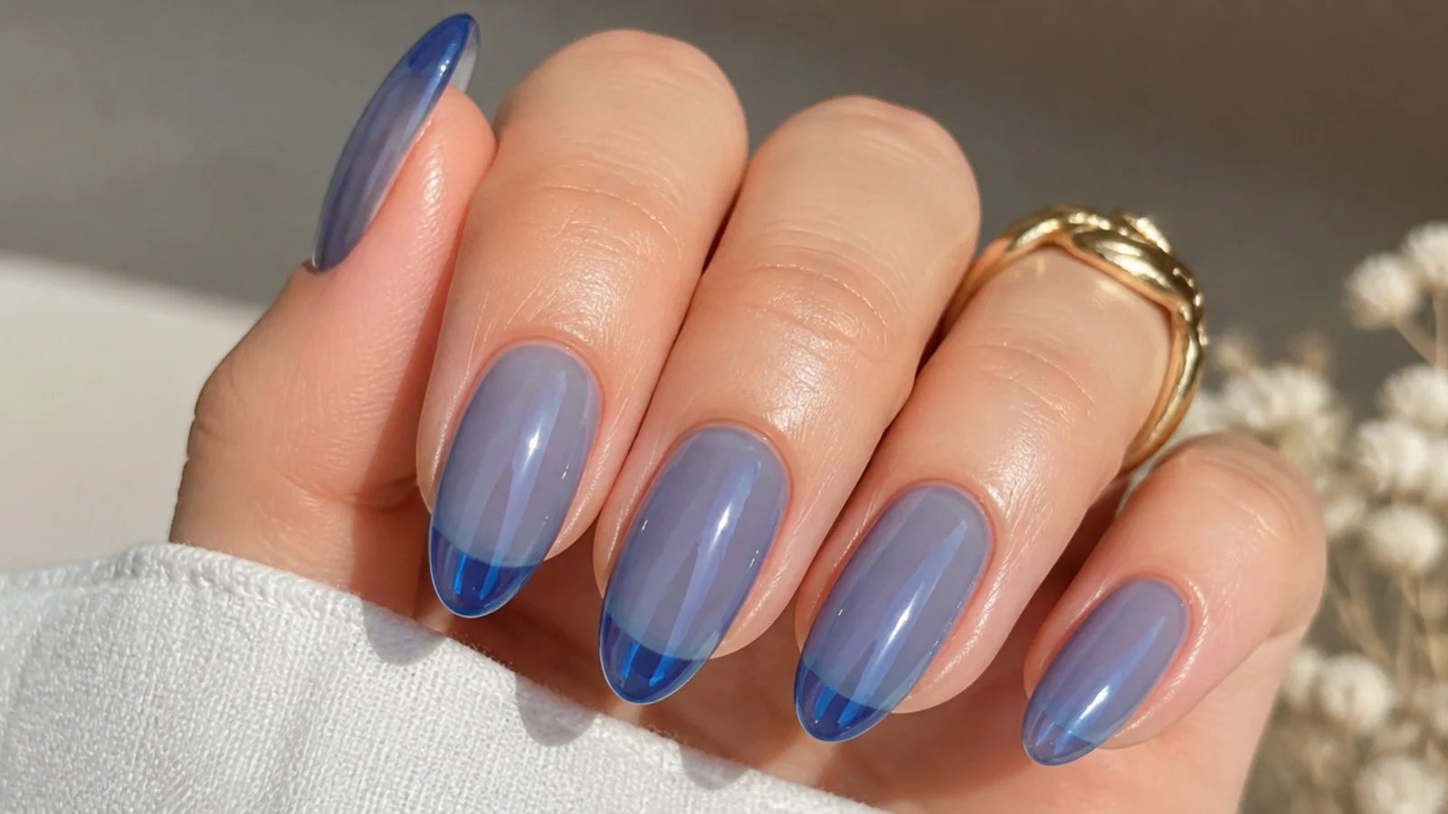 Sheer translucent royal blue jelly nails with a glass-like finish