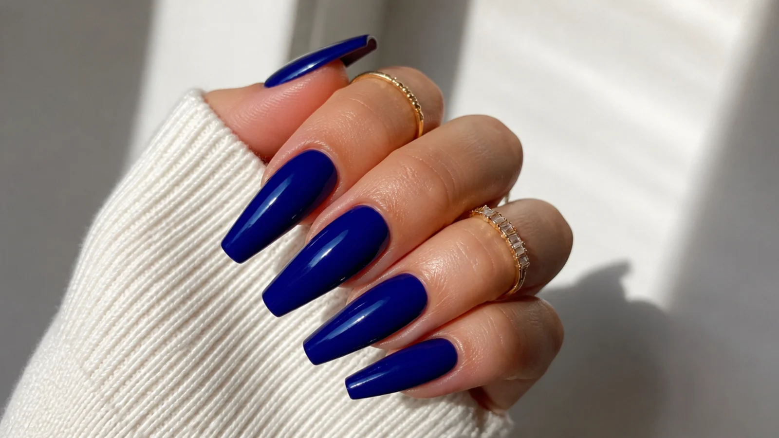 Long deep cobalt royal blue coffin nails with a glossy finish
