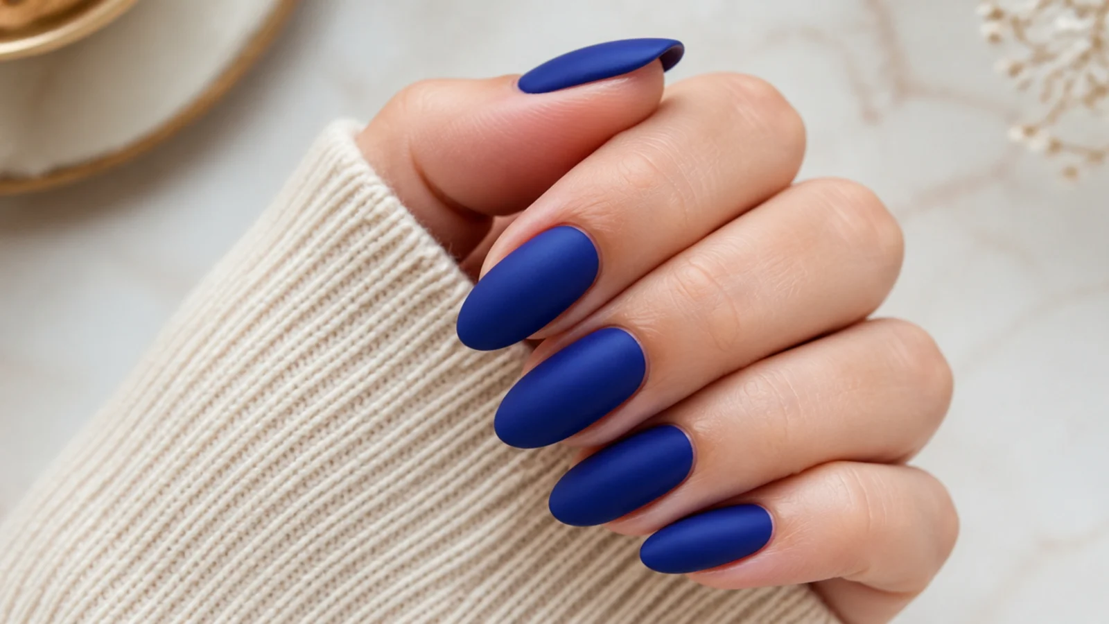 Matte royal blue nails with a soft velvety flat finish