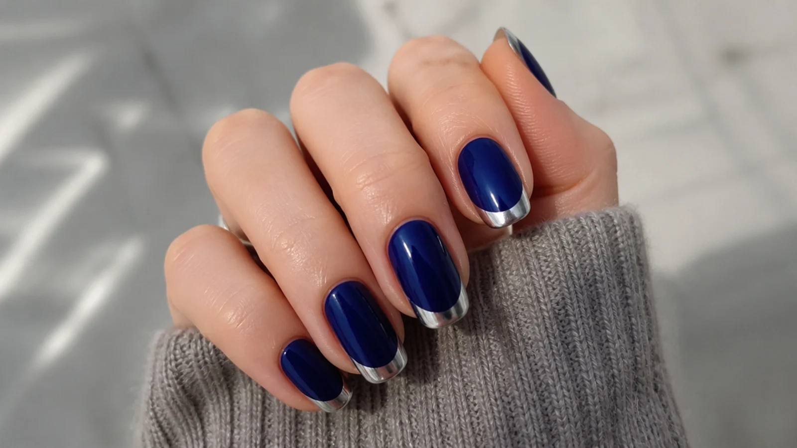 Royal blue nails with metallic silver chrome french tips