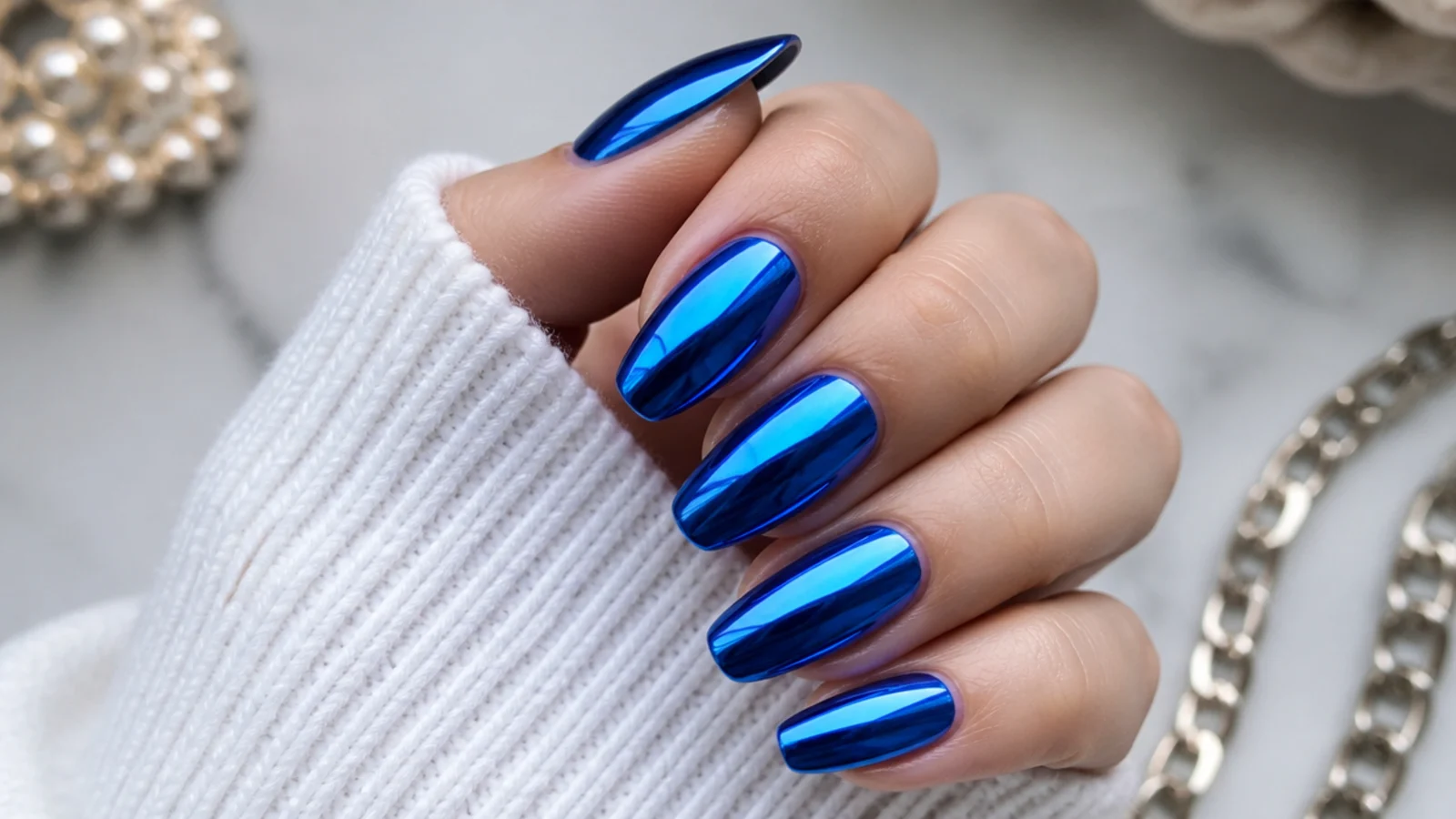 Mirror-finish royal blue chrome nails with a metallic reflective shine