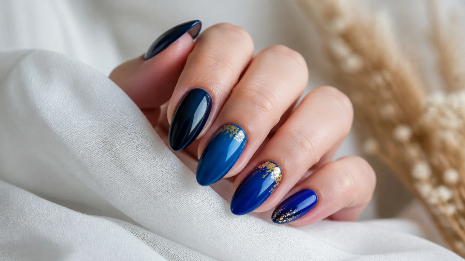 Royal blue to deep navy ombre nails blending dark to bright