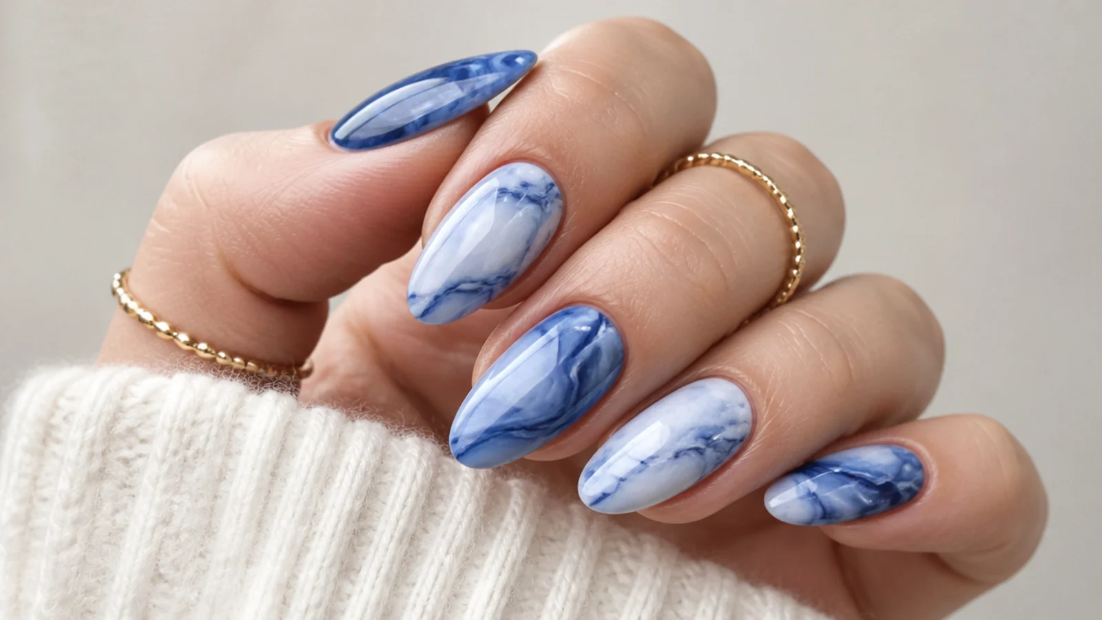 Royal blue and white marble swirl nails with soft veining