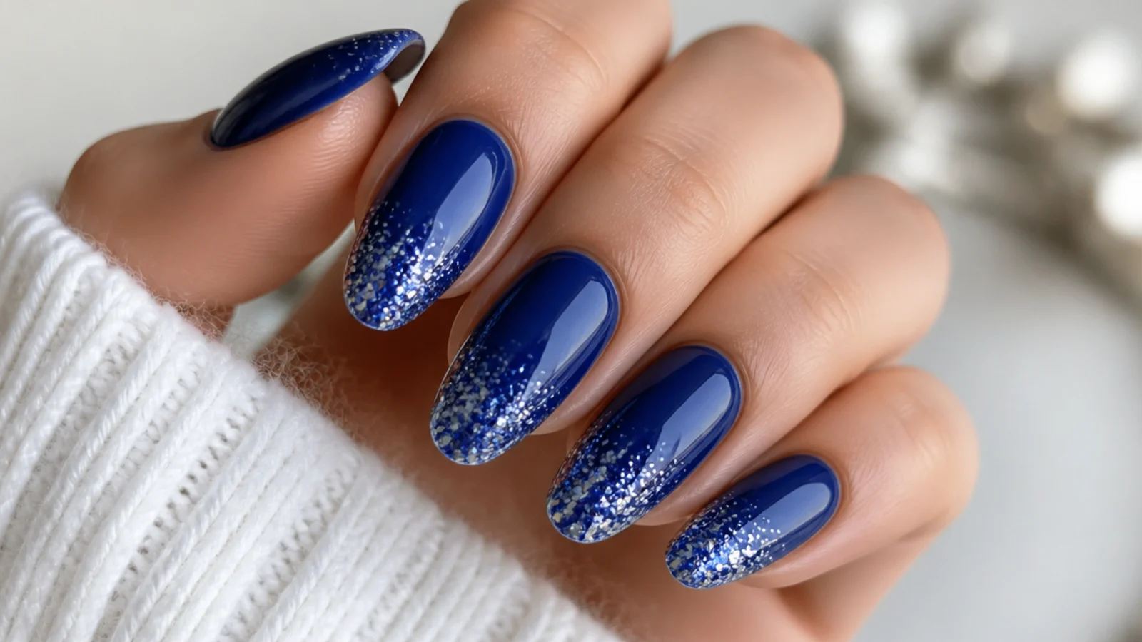 Royal blue nails with sparkling blue and silver glitter dipped tips