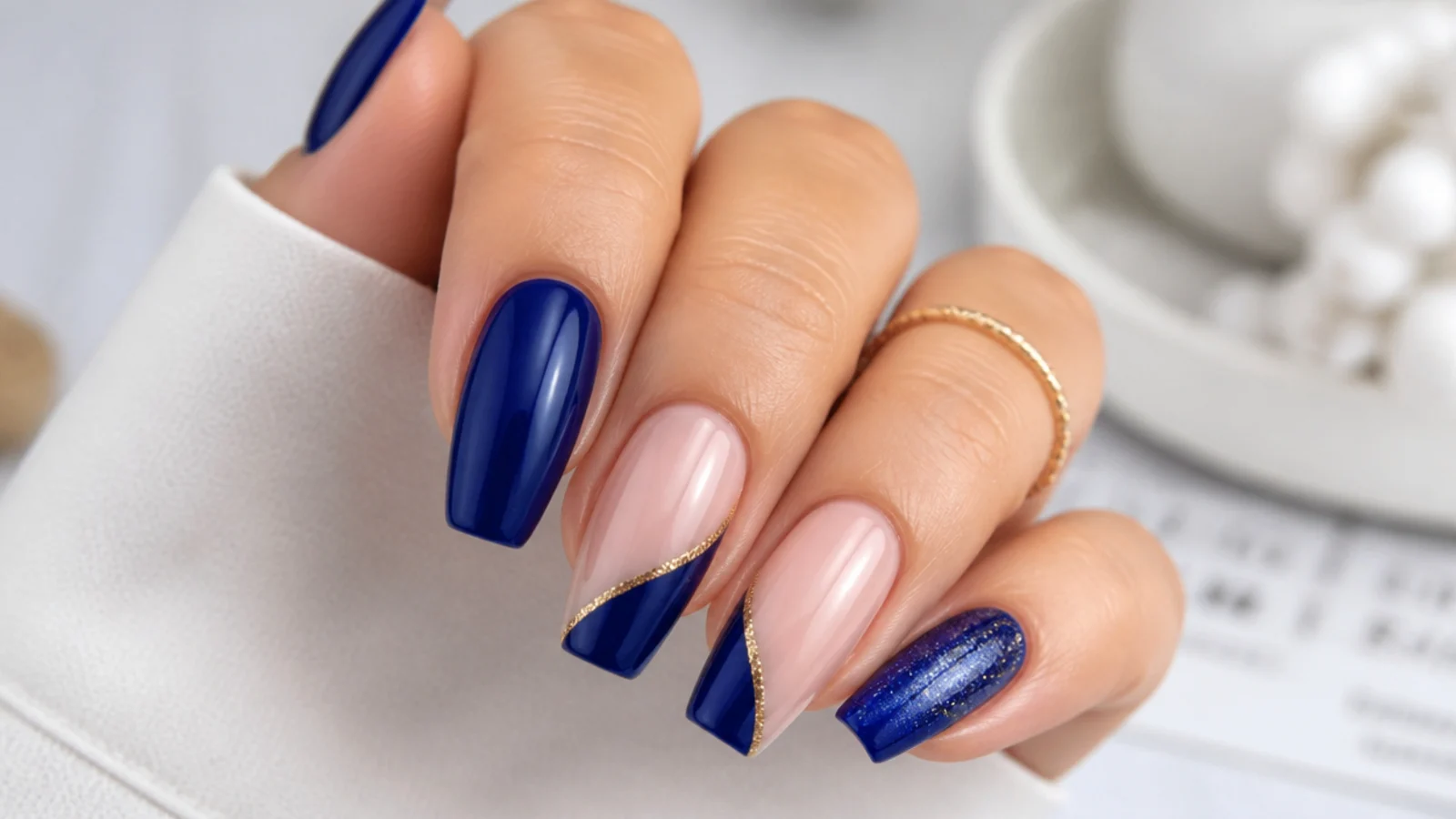 Royal blue nails styled for prom, a wedding and an evening event