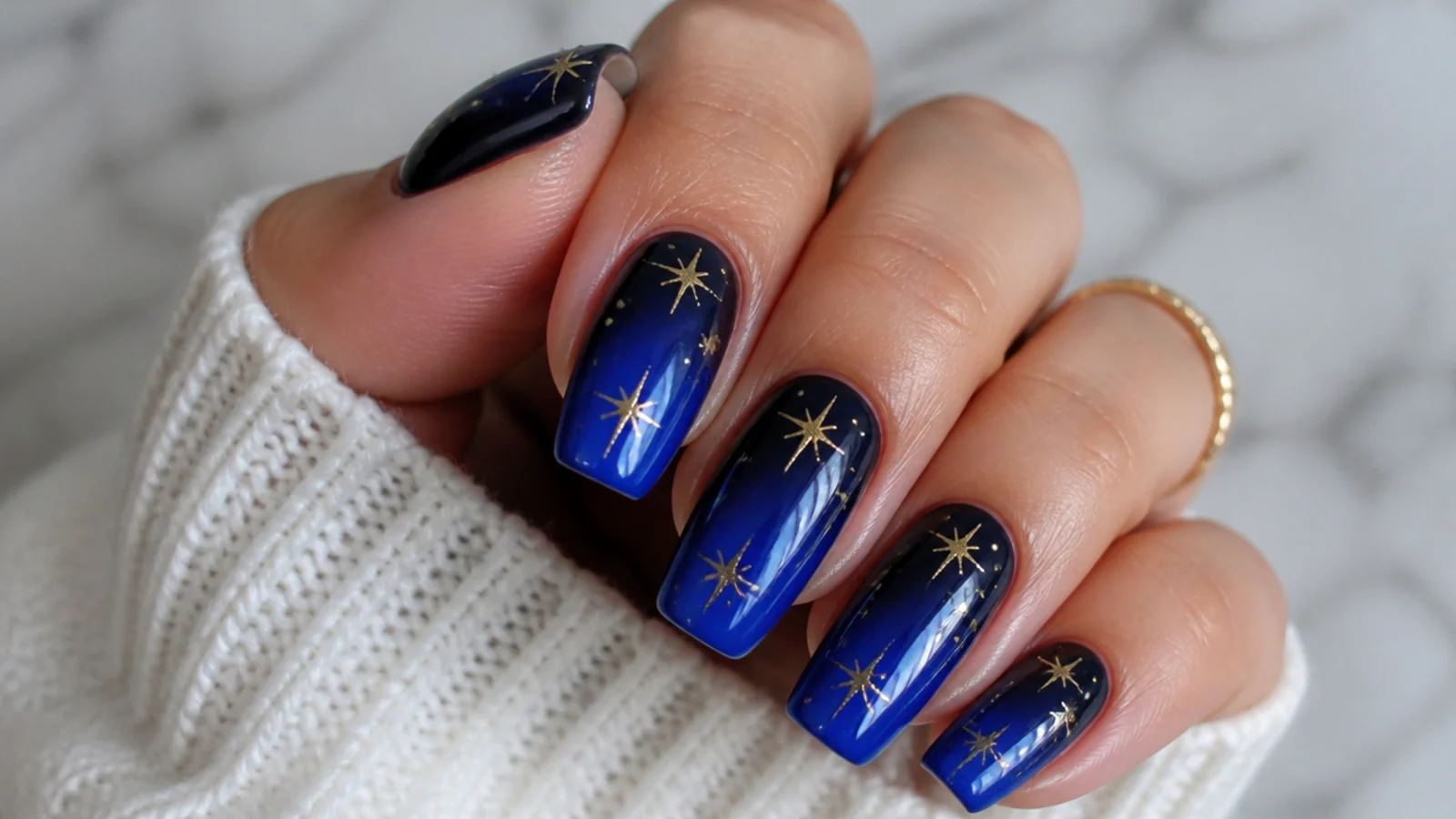 Royal blue nails fading into deep navy at the cuticle