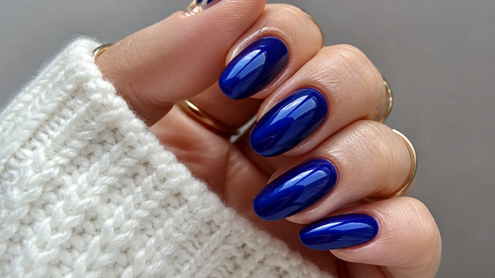 A well-sealed royal blue gel manicure with cuticle oil for longevity