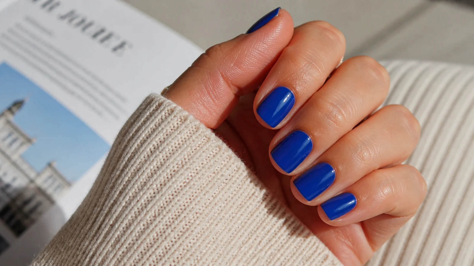Short square nails in opaque cobalt blue cream with a flat even glossy finish