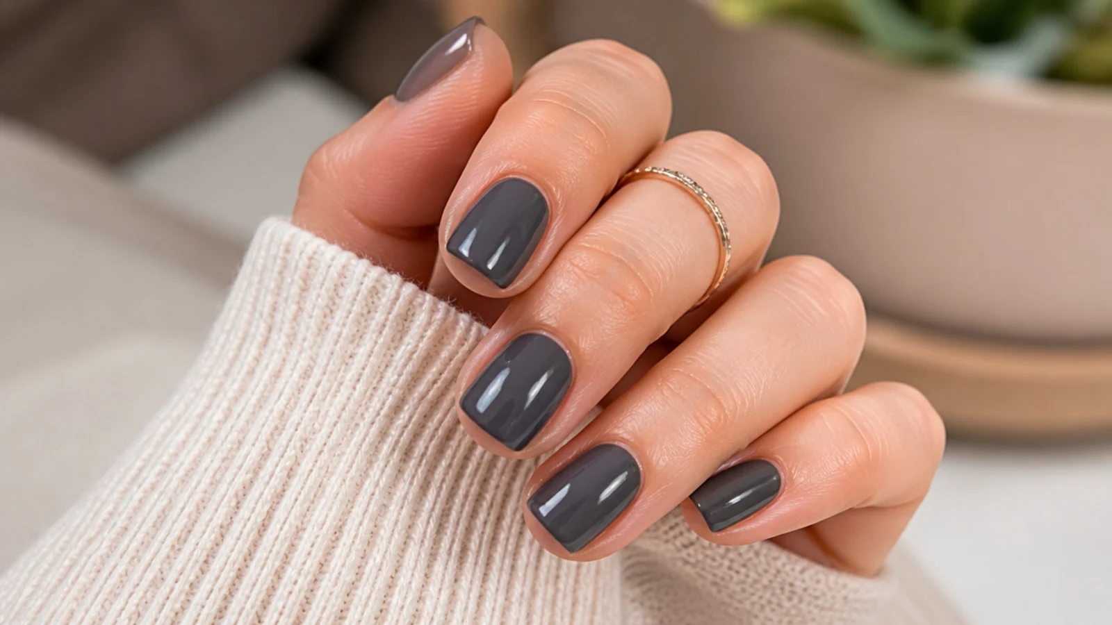 Short soft square nails in charcoal gray cream polish with a smooth glossy surface