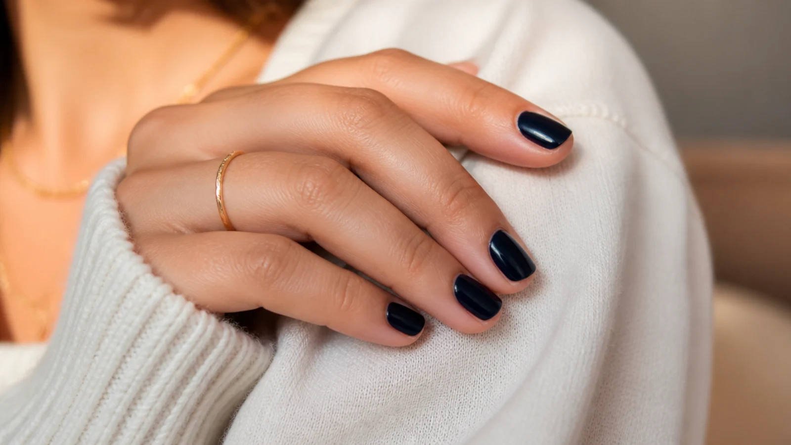 Short nails in midnight navy blue creme with a deep glossy almost black finish