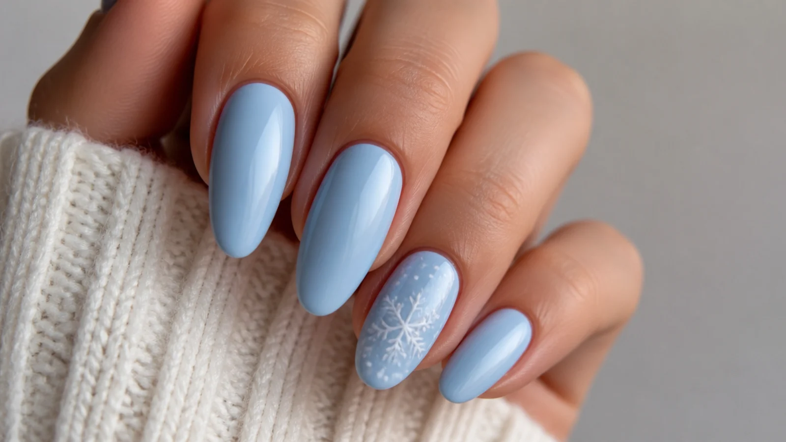 Icy blue nails with one white snowflake on a single accent nail