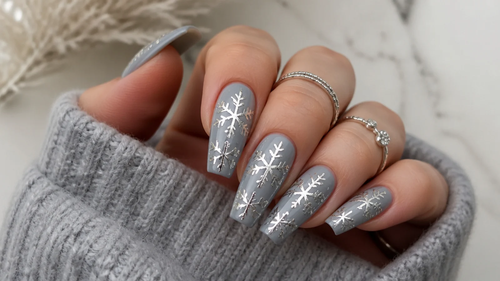 Mirror silver chrome snowflakes over a cool gray base on coffin nails