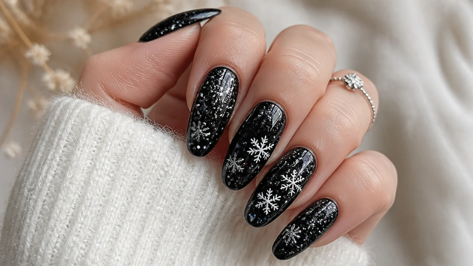 Black glitter snowflake nails with silver flakes and sparkle