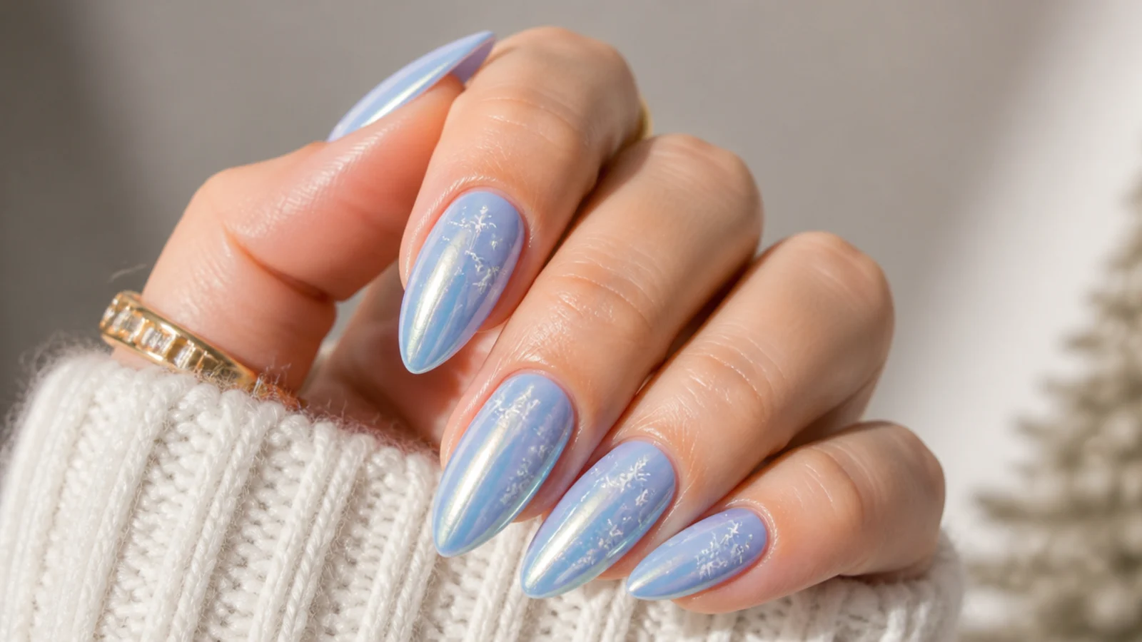 Powder blue chrome acrylic nails with white snowflakes
