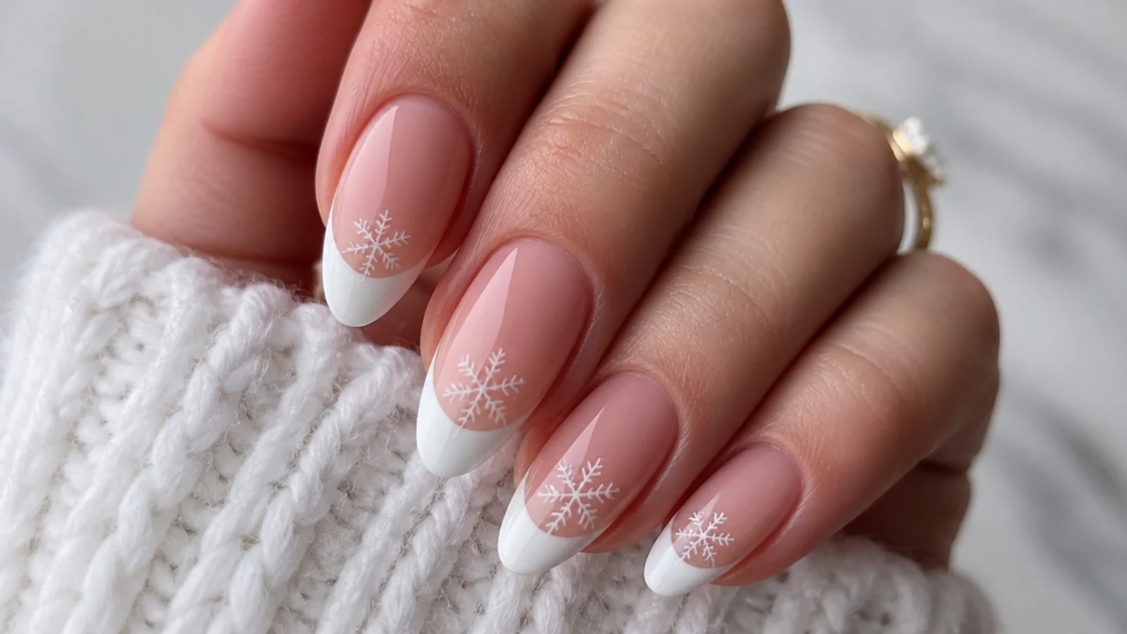 White French tip winter snowflake nails with a small snowflake on the tip